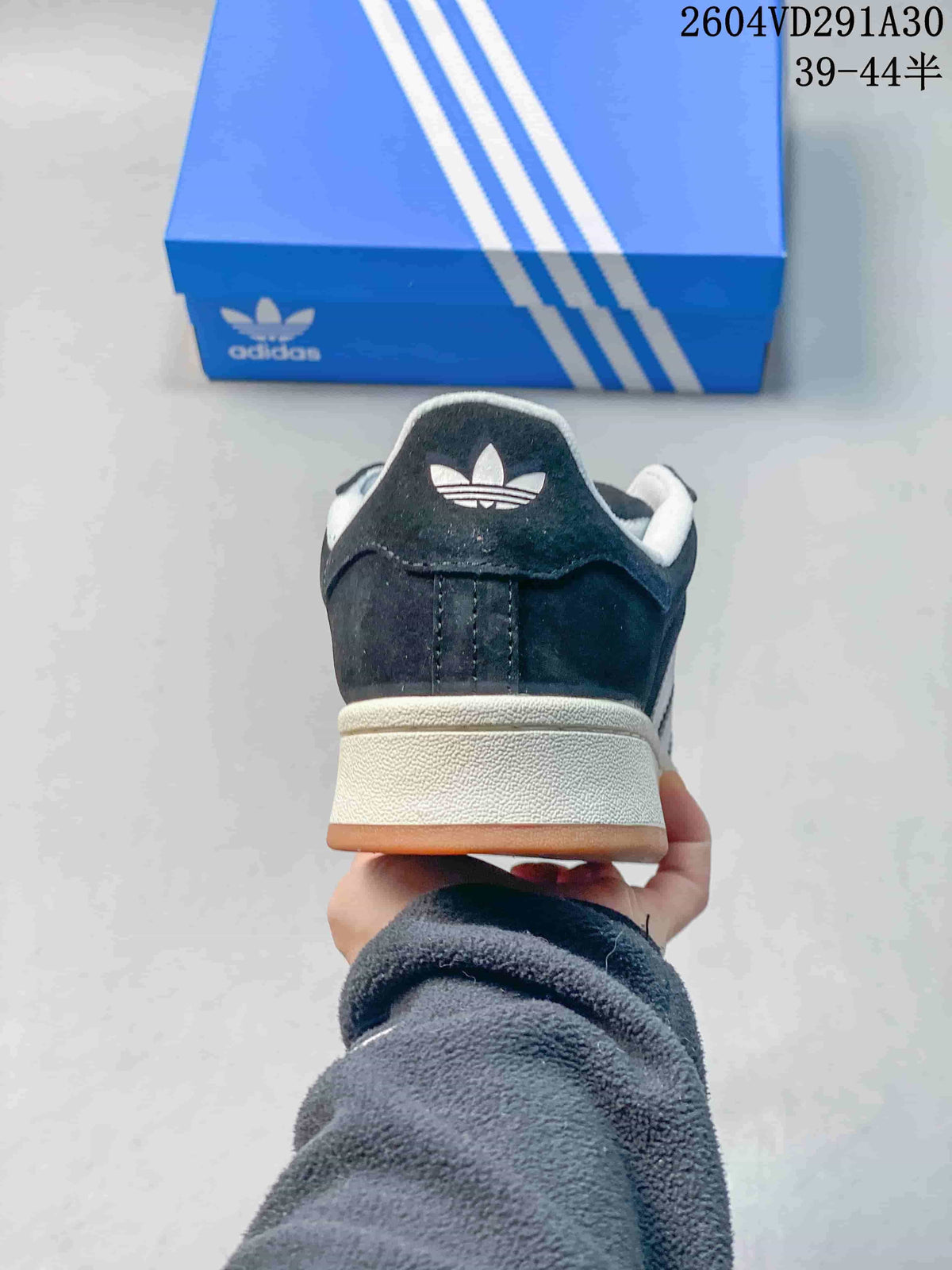 Rear view showing the heel branding and layered off-white midsole