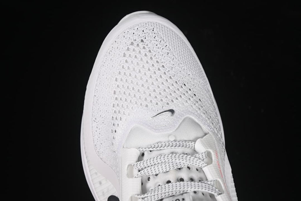 Top-down view of the white mesh toe box and laces.