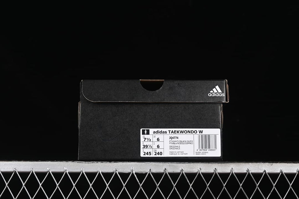 Shoe box label identifying the adidas Taekwondo W, model JQ4774, and sample size markings.