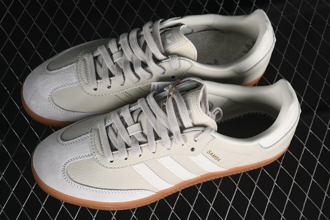 Pair of off-white Samba OG sneakers with light grey details and gum soles