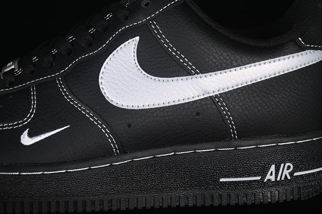 Close-up of the white side accent, contrast stitching, and Air-marked midsole