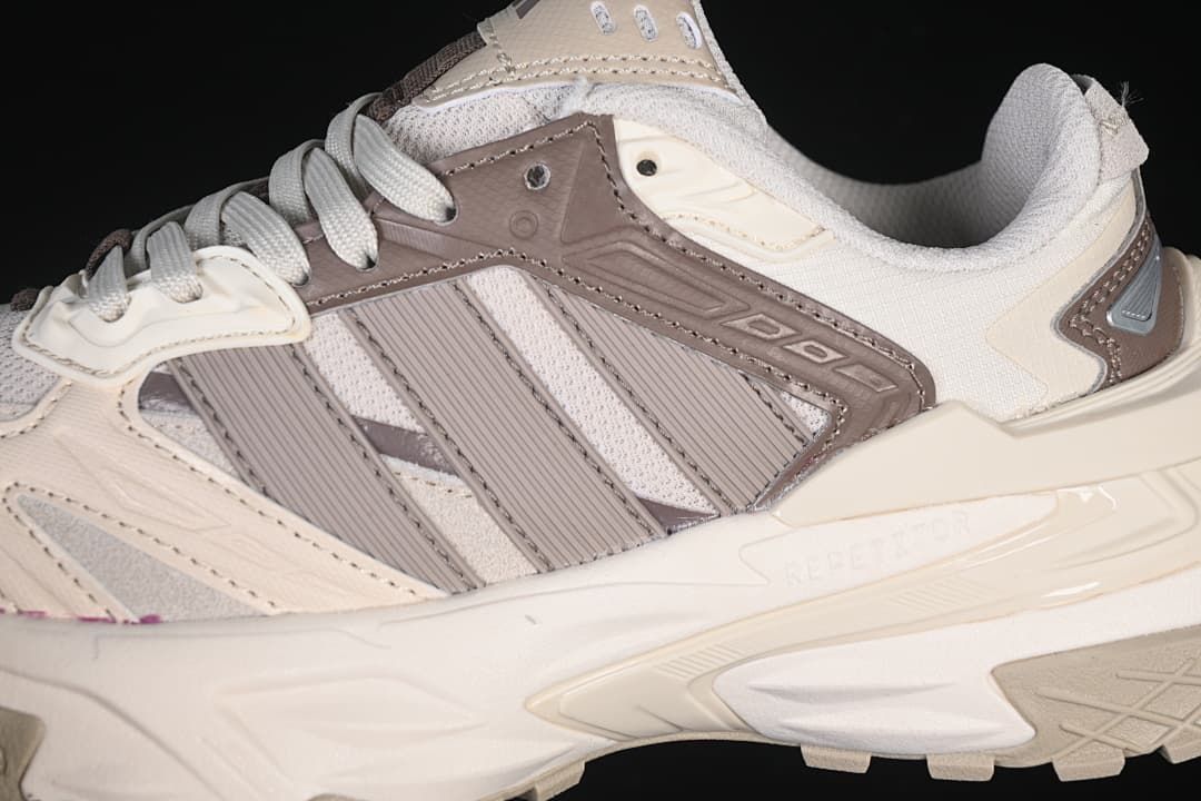 Close-up of the sneaker's side panels, mesh sections, and sculpted sole.