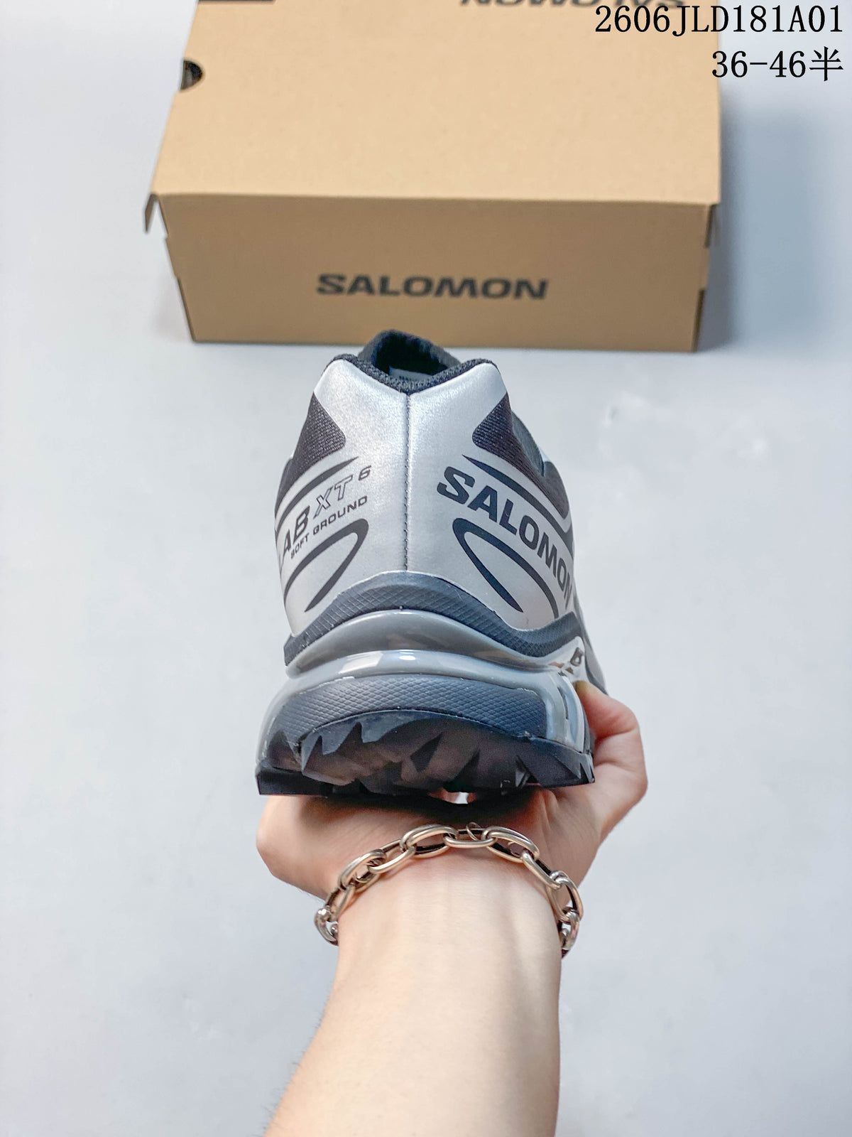Rear view of a gray and silver Salomon XT-6 sneaker