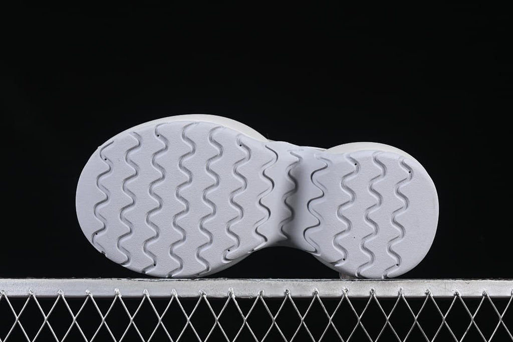 Underside view showing the wavy outsole tread