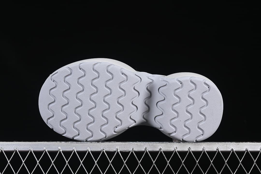 Underside view showing the wavy outsole tread