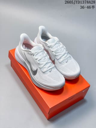 Pair of white Nike Air Zoom Pegasus 42 shoes displayed on an orange box.