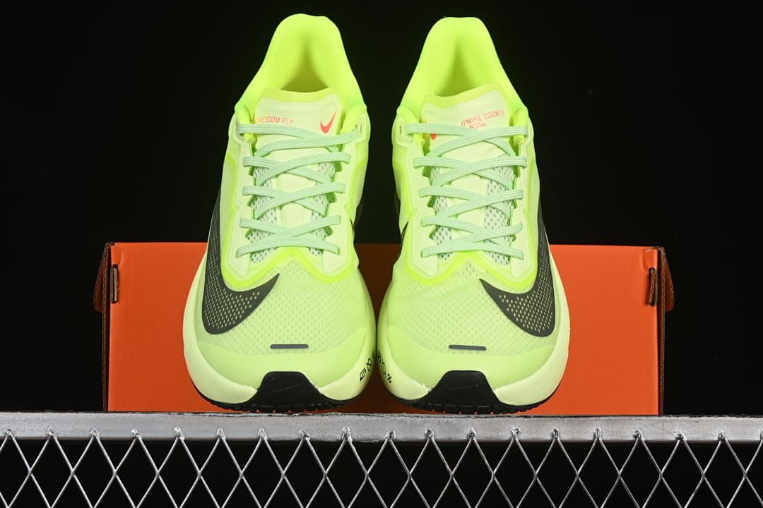 Front view of the pair showing the laces, mesh uppers, and dark Swooshes.