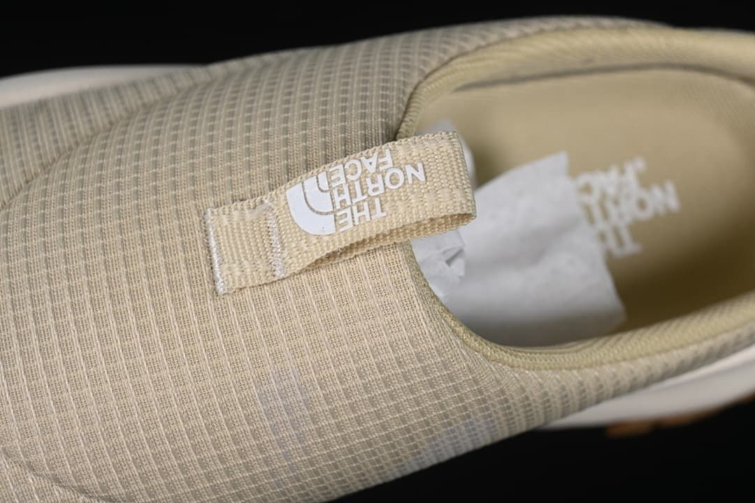Close-up of the upper and branded pull tab.