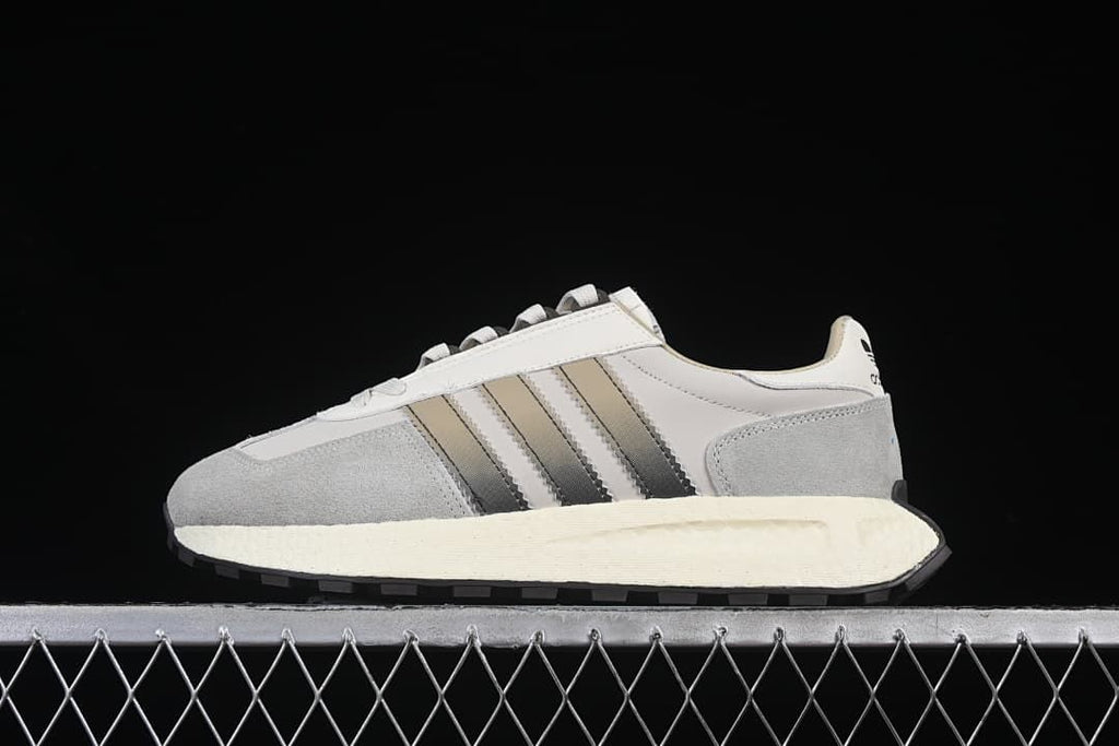 Side profile of a grey and white adidas Retropy E5 sneaker