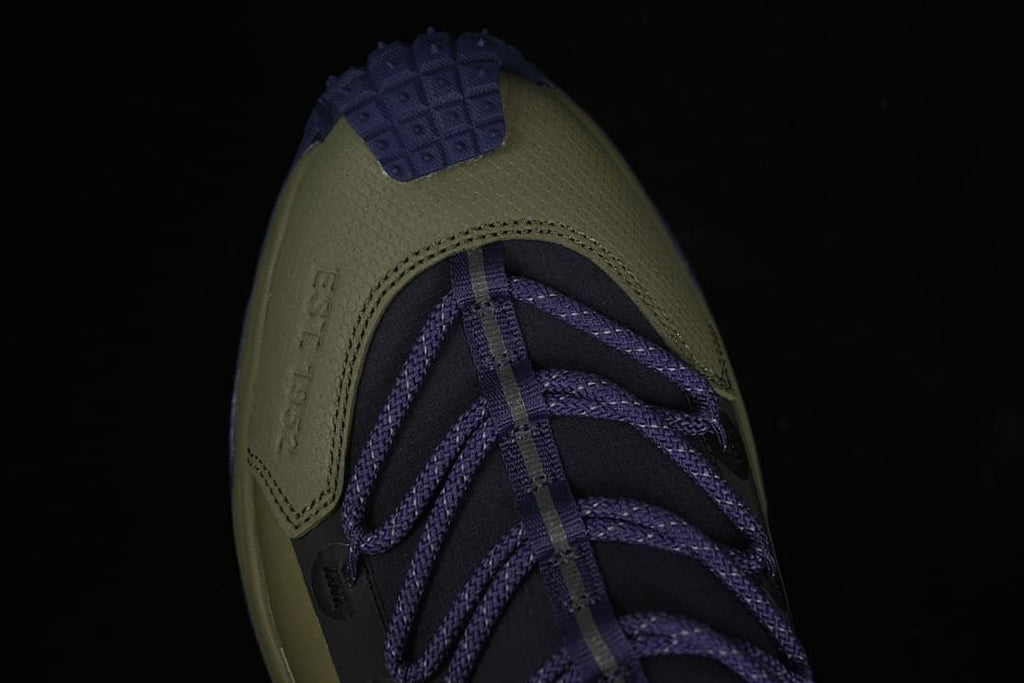 Top view of the olive toe and purple laces