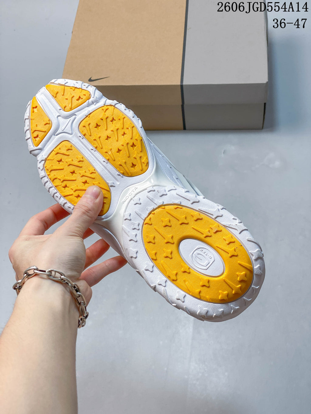 Close-up of the sneaker outsole with yellow traction sections