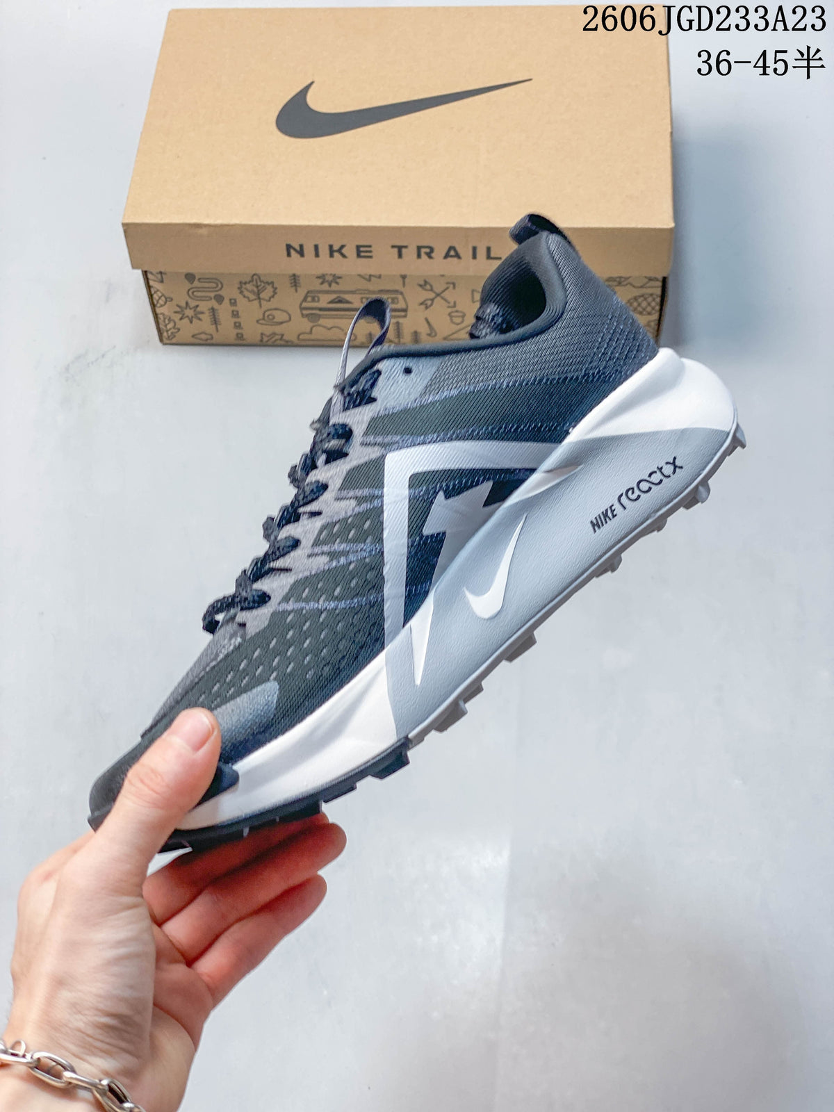 Side view of a gray Nike Wildhorse 10 shoe with white Swoosh and midsole