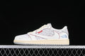 Side view of off-white Jordan 1 low-top sneakers with patterned panels, red trim, and cream midsole.