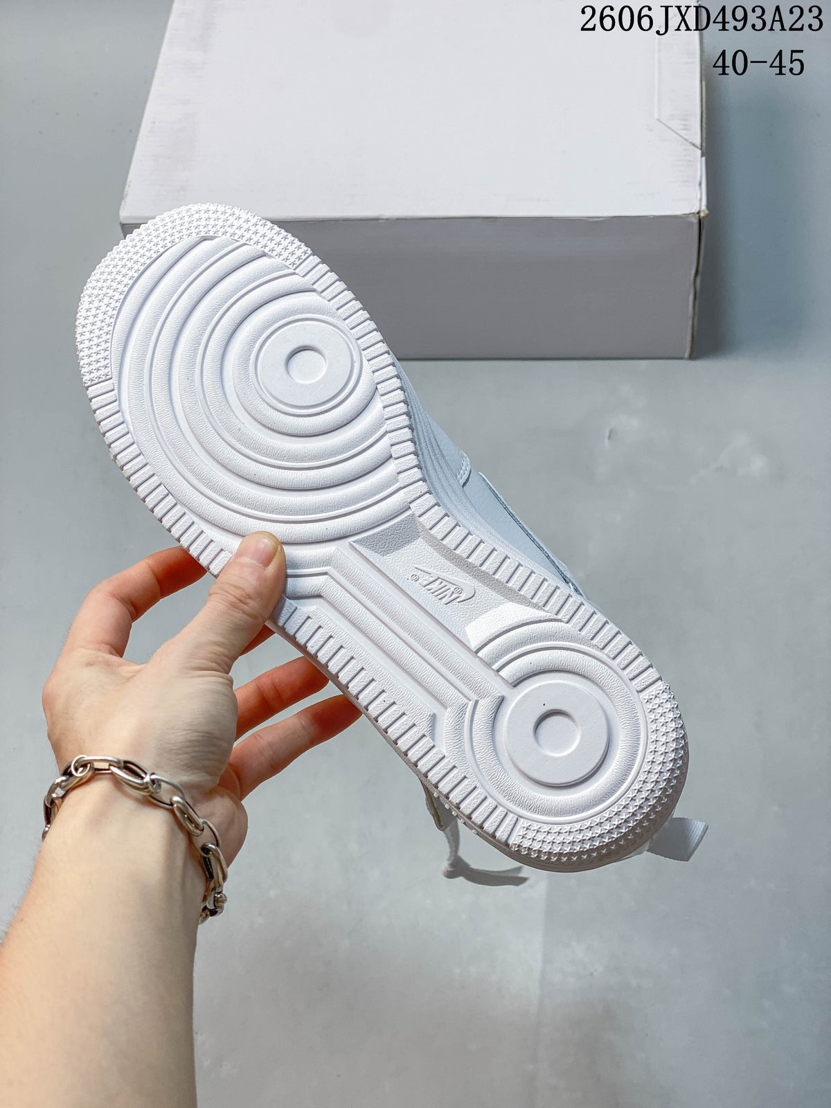 Close-up of the white sneaker outsole and circular tread pattern