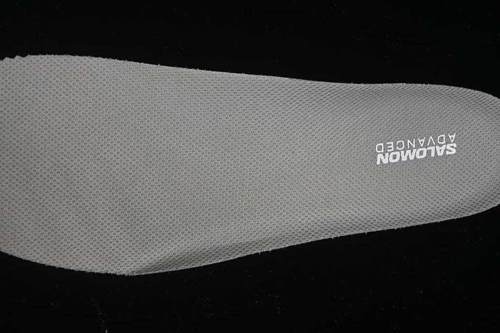 Close-up of the textured insole marked Salomon Advanced