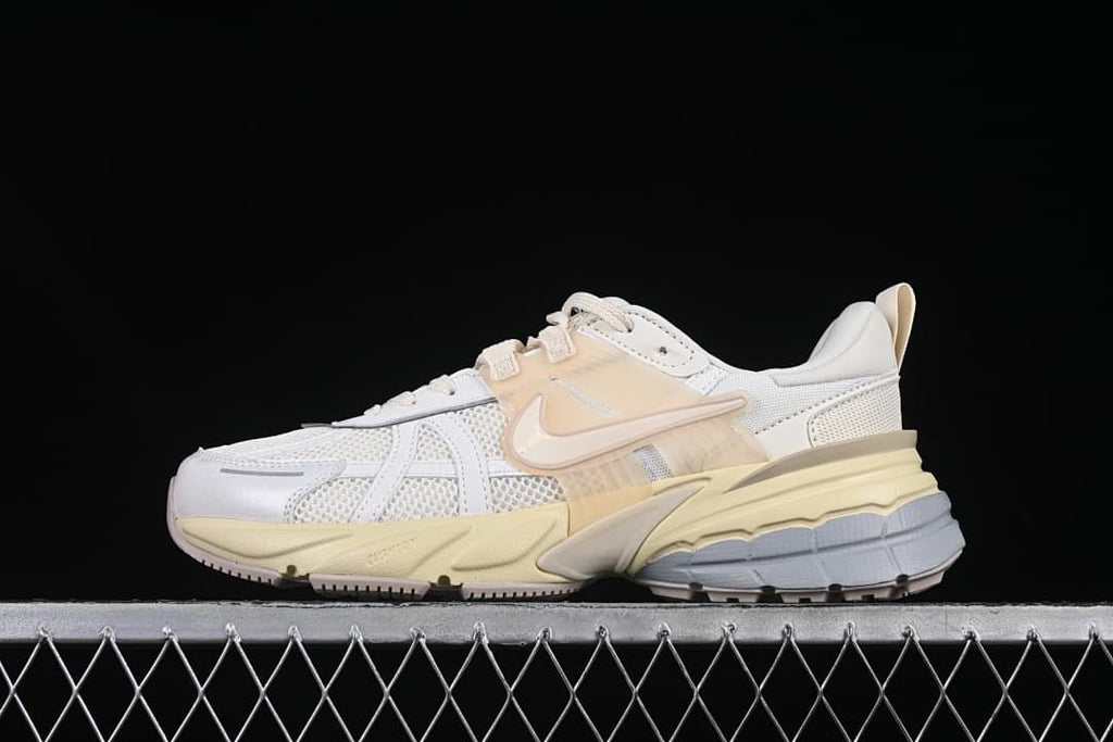 Side profile of the white and pale yellow Nike V2K Run sneaker