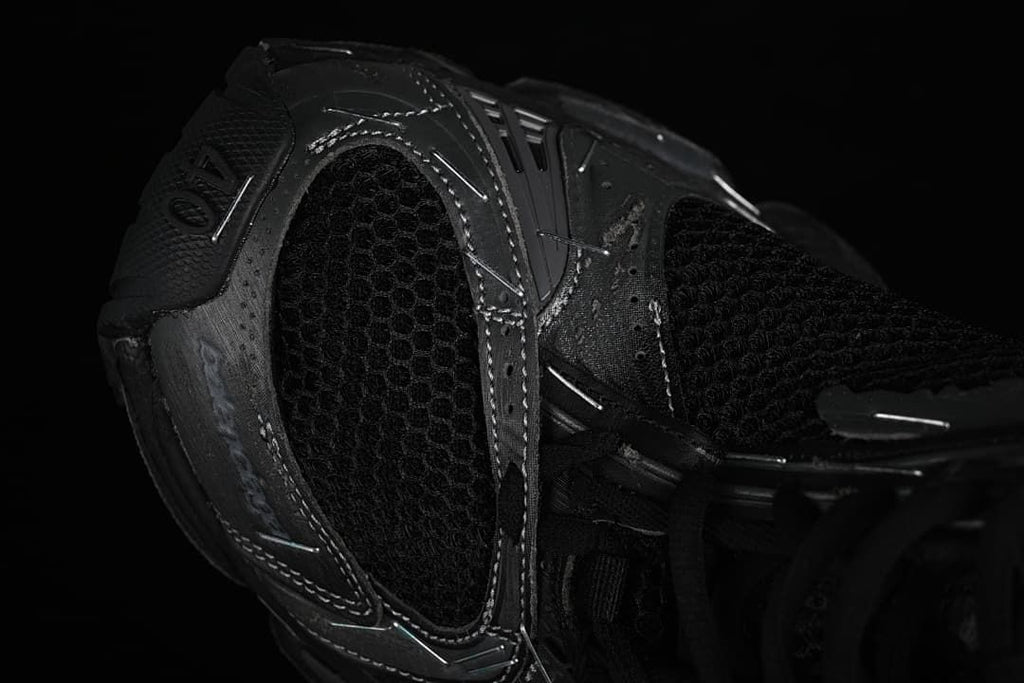 Close-up of the rear quarter, mesh panel, and layered overlays.