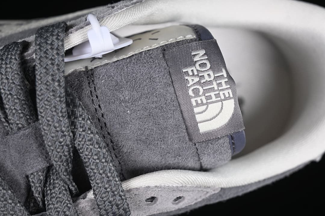 Close-up of the tongue label and dark laces