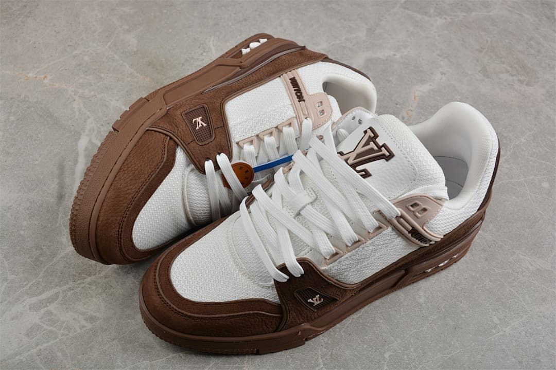 Pair of brown and white low-top sneakers shown from above.