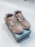 Pair of taupe-toned New Balance 204L sneakers shown from the front and side