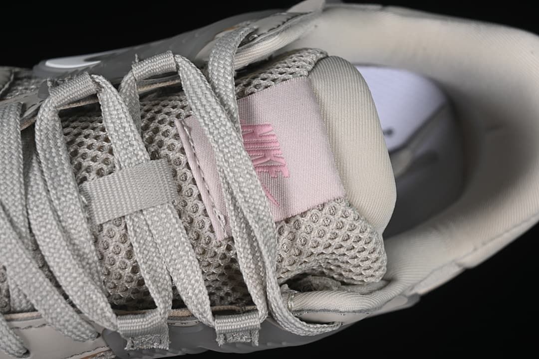 Close-up of grey laces and tongue label