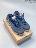 White and dark gray low-top sneakers shown from above with segmented transparent-looking soles.