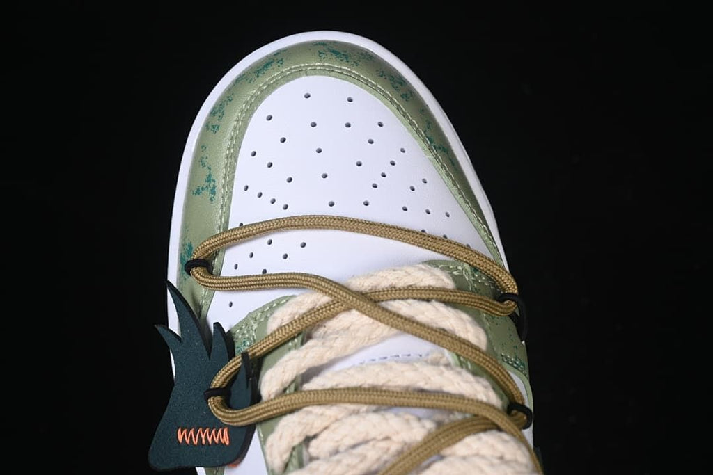Top view of the perforated toe and layered lacing