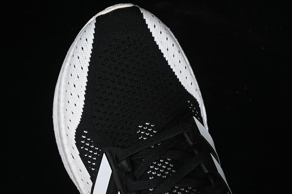 Top view showing the black upper and white perforated side panels