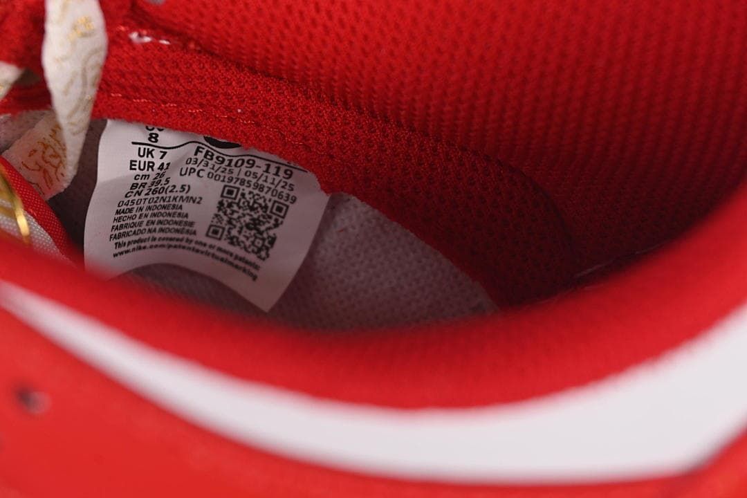 Shoe size label inside the red and white sneaker