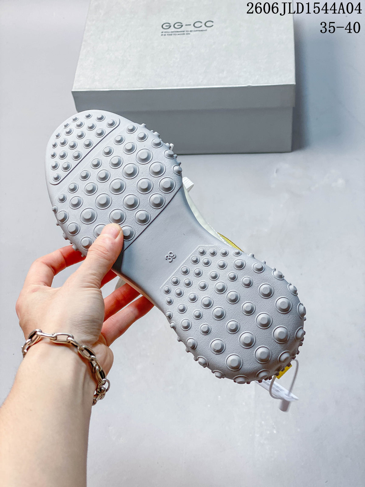 Close-up of the sneaker's gray outsole with raised circular details.