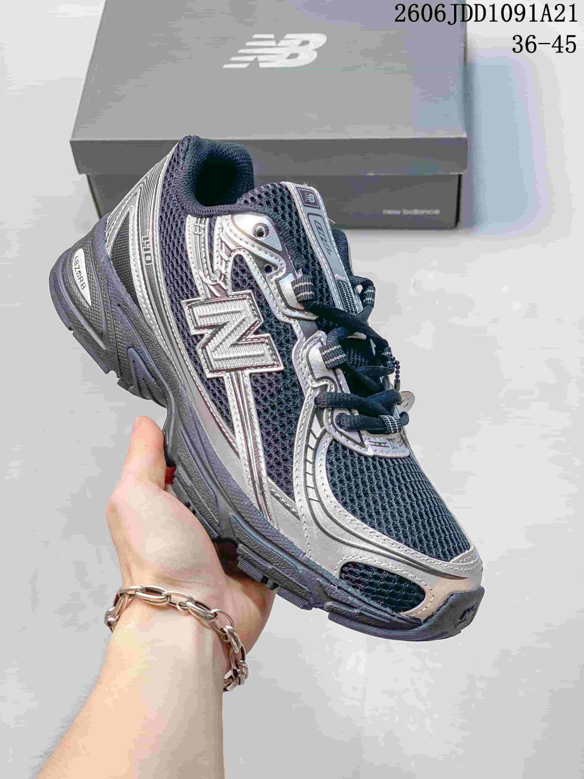 Angled side view of a New Balance 740 sneaker with its logo and layered overlays
