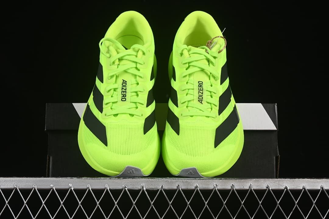Front view of the pair showing the neon yellow uppers and black stripes.