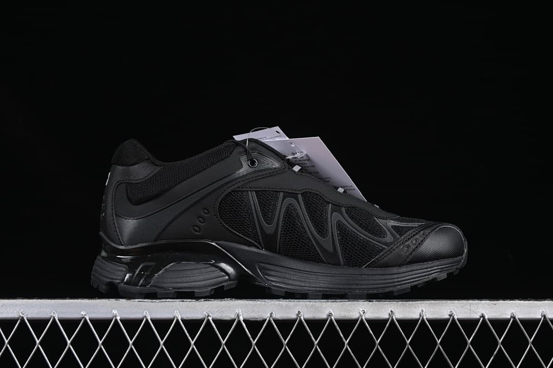 Side profile showing the black shoe's layered design