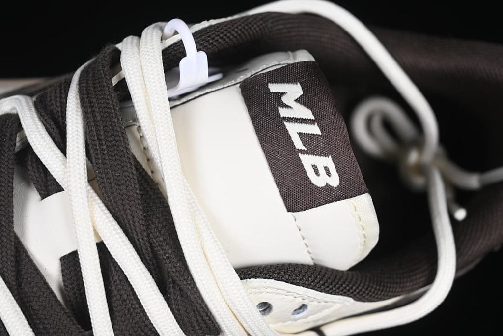 Close-up of tongue label with MLB lettering and layered laces