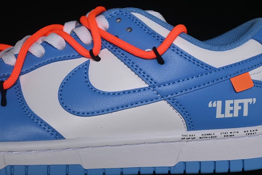 Close-up of the side Swoosh, “LEFT” lettering, and orange-red overlay laces.