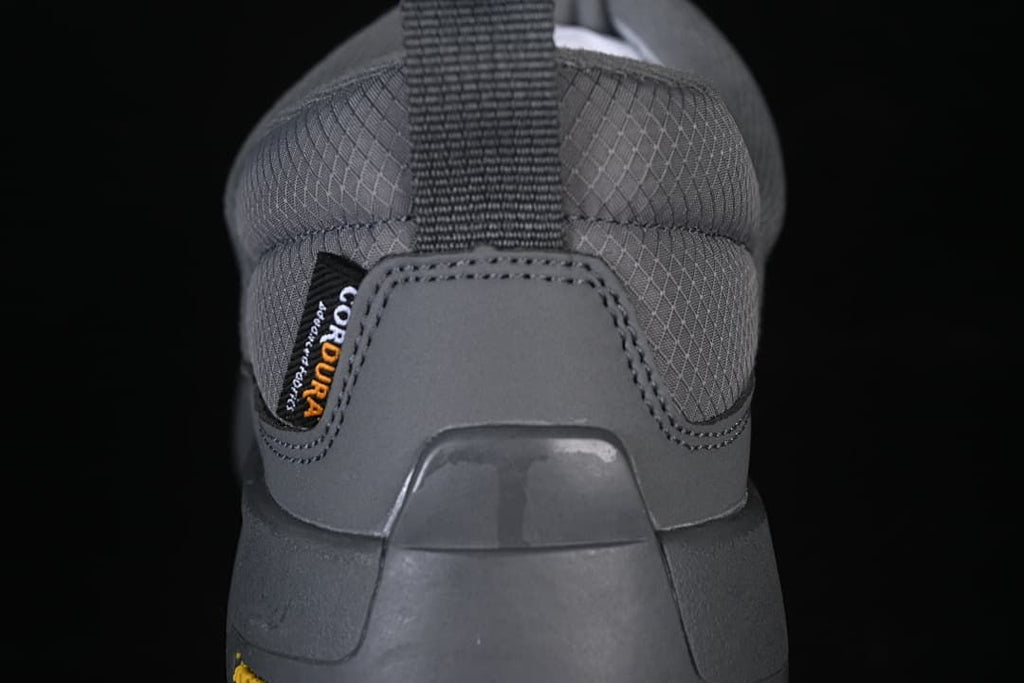 Rear view of the grey shoe with heel pull loop