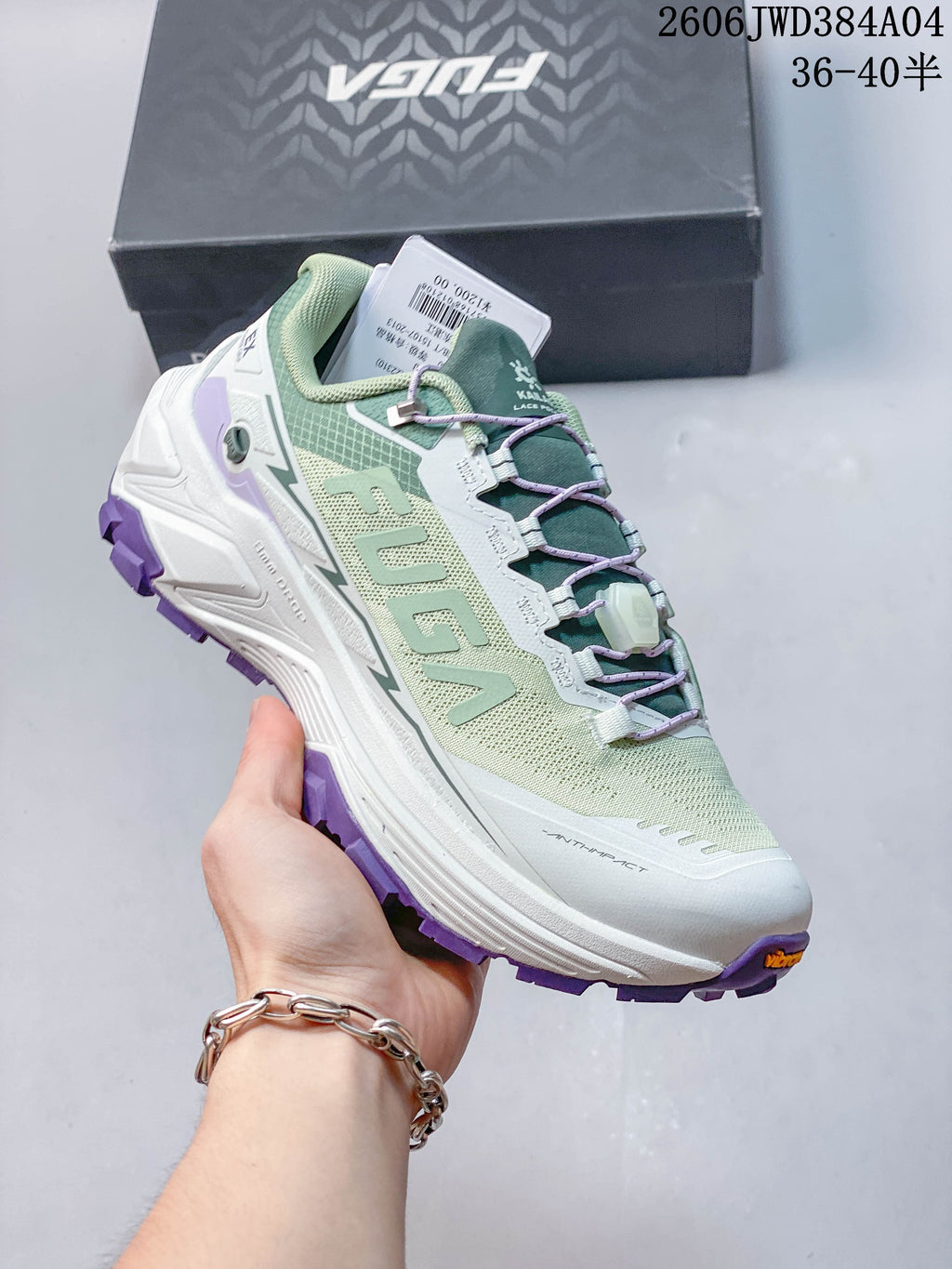 Side view of a Kailas Fuga EX3 shoe with mint green upper and purple tread