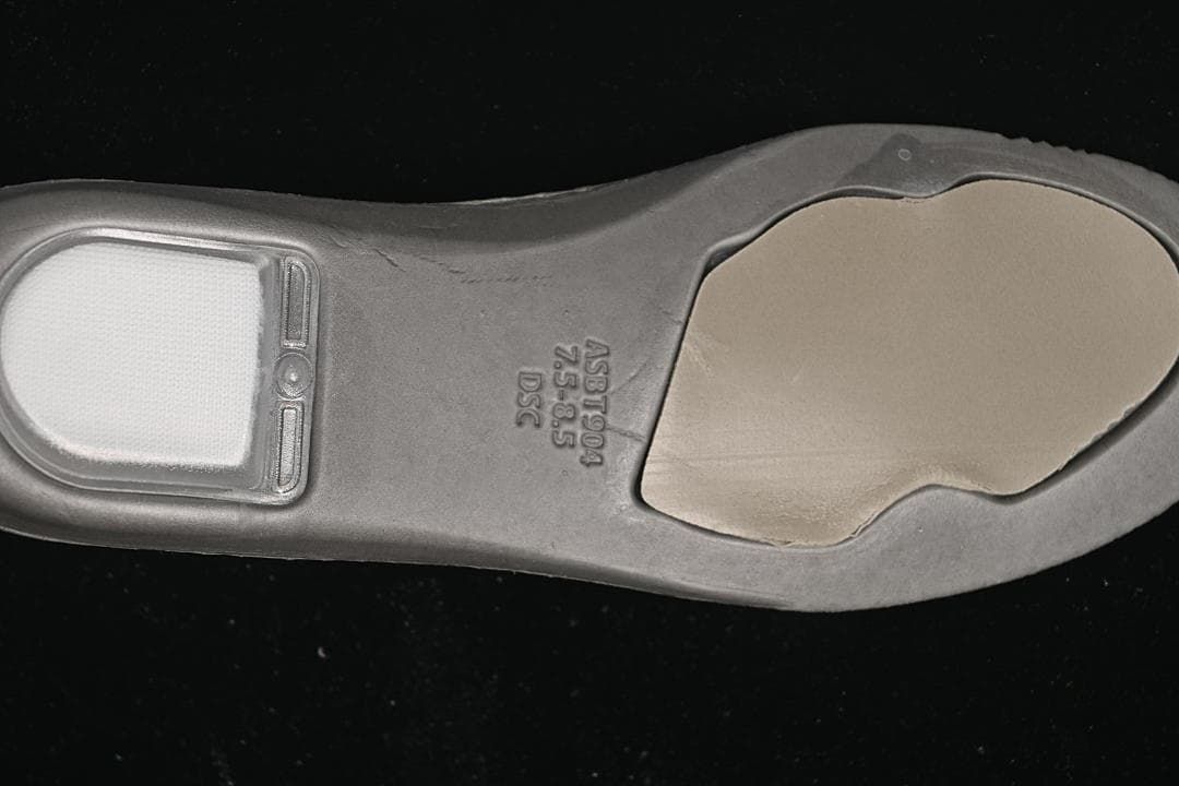 Close-up of the sneaker insole showing a size marking of 42.5.
