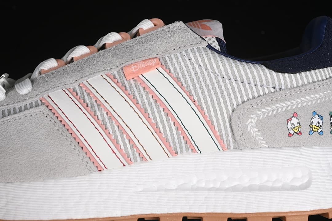 Close-up of the side stripes, character graphic, and white midsole