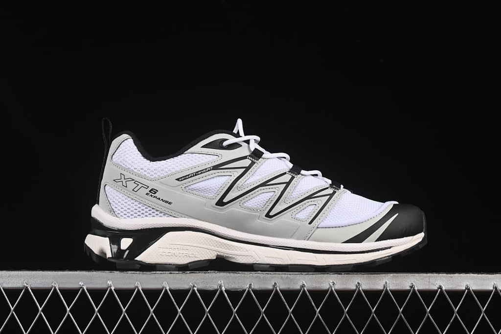 Side profile of a Salomon XT-6 Expanse sneaker in white, gray, and black.
