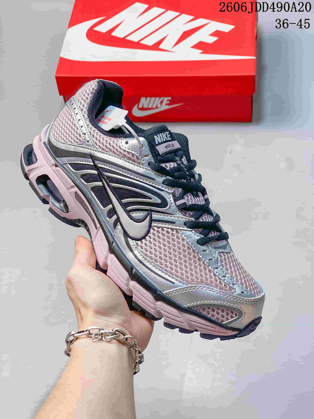 Silver mesh Nike Air Max Moto 2K sneaker with dark navy details