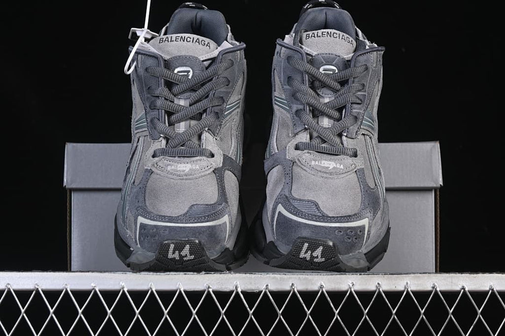 Front view of the pair showing the laces and layered toe panels