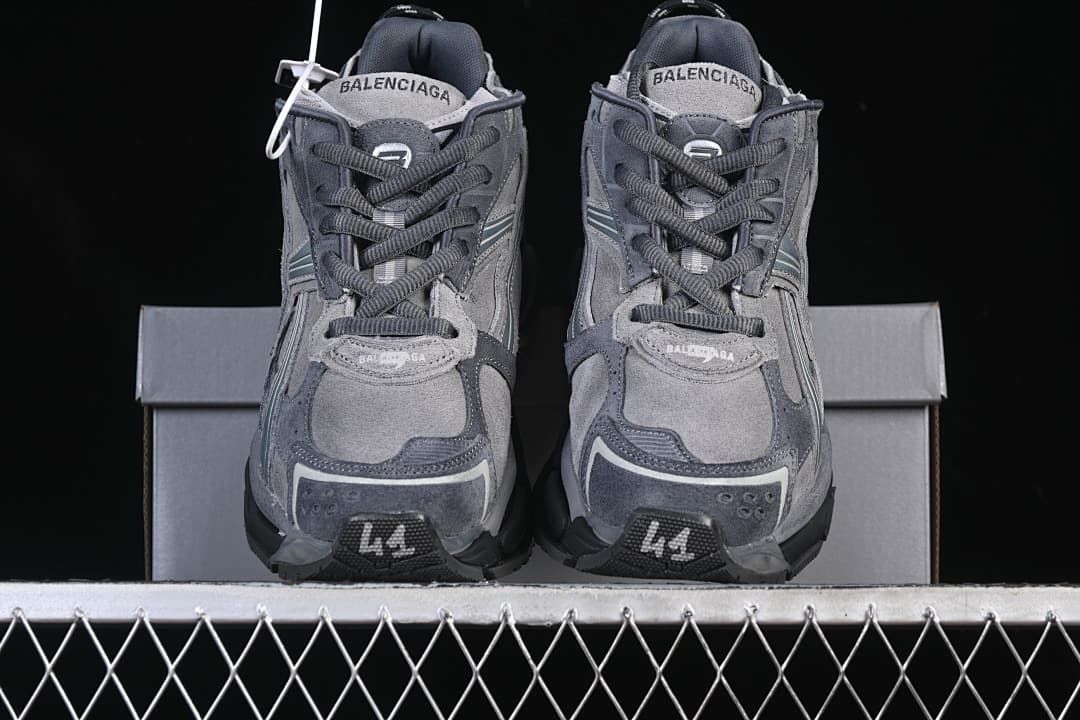 Front view of the pair showing the laces and layered toe panels