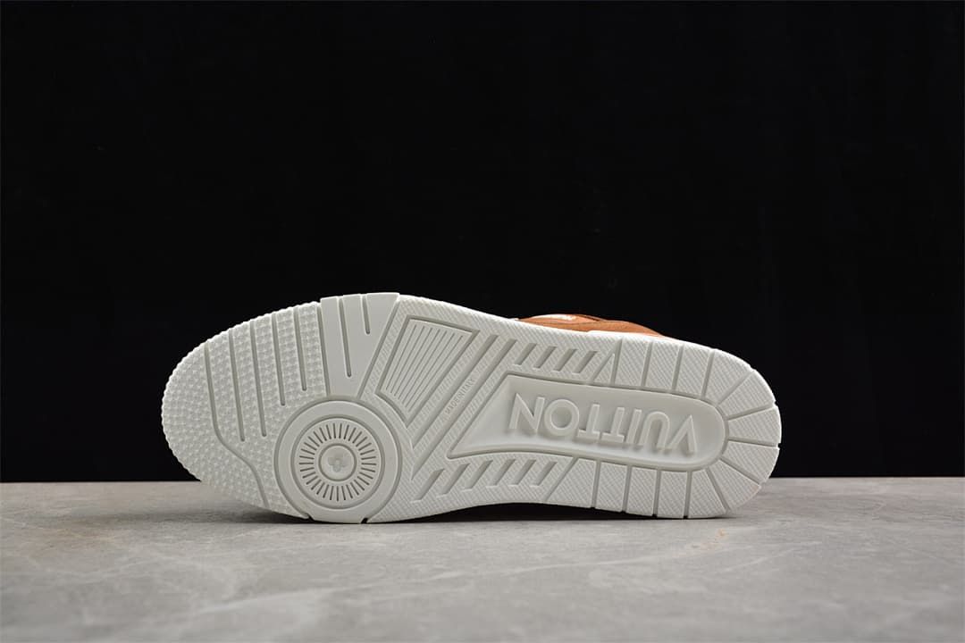 Underside of a white sneaker sole with molded tread and lettering