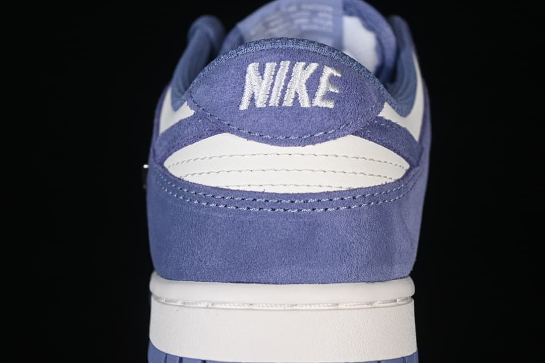 Rear view showing blue heel panels and white accents