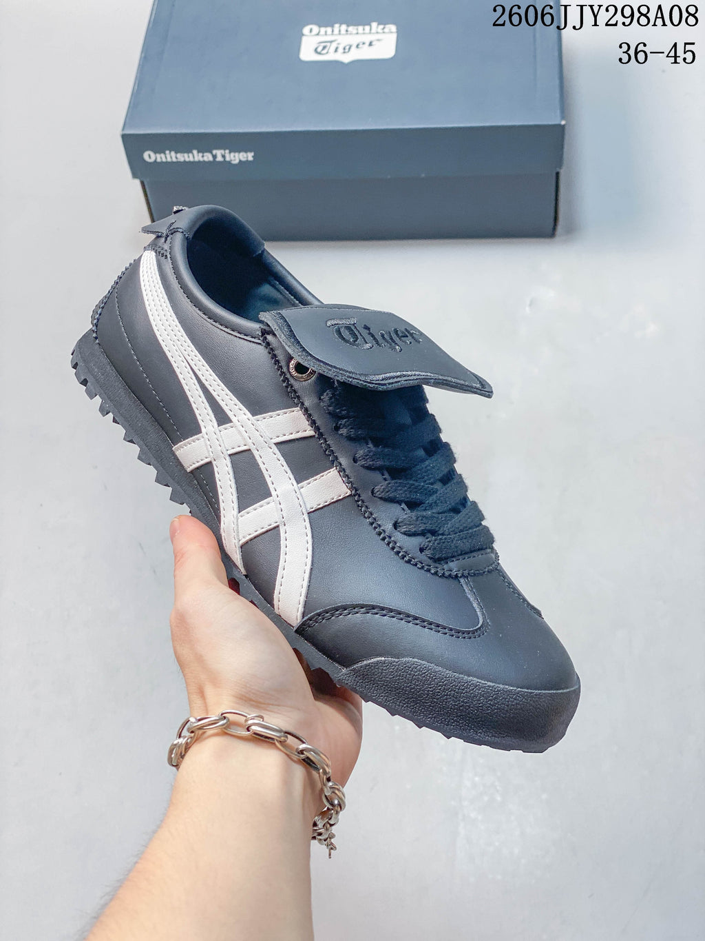 Charcoal Onitsuka Tiger Mexico 66 Golf sneaker with white side stripes and a lugged outsole.
