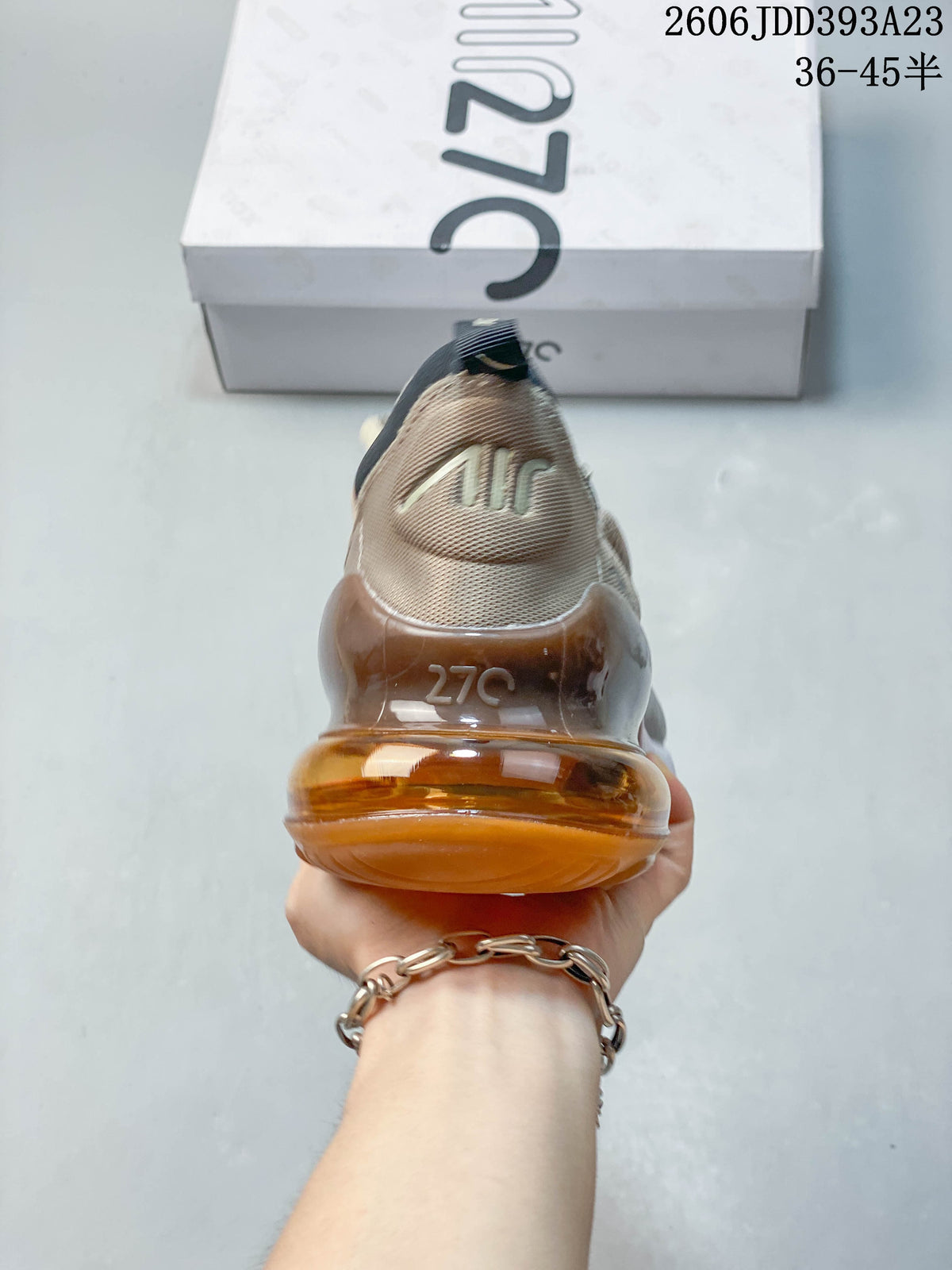 Rear view of a Nike Air Max 270 sneaker highlighting the amber-colored heel unit.