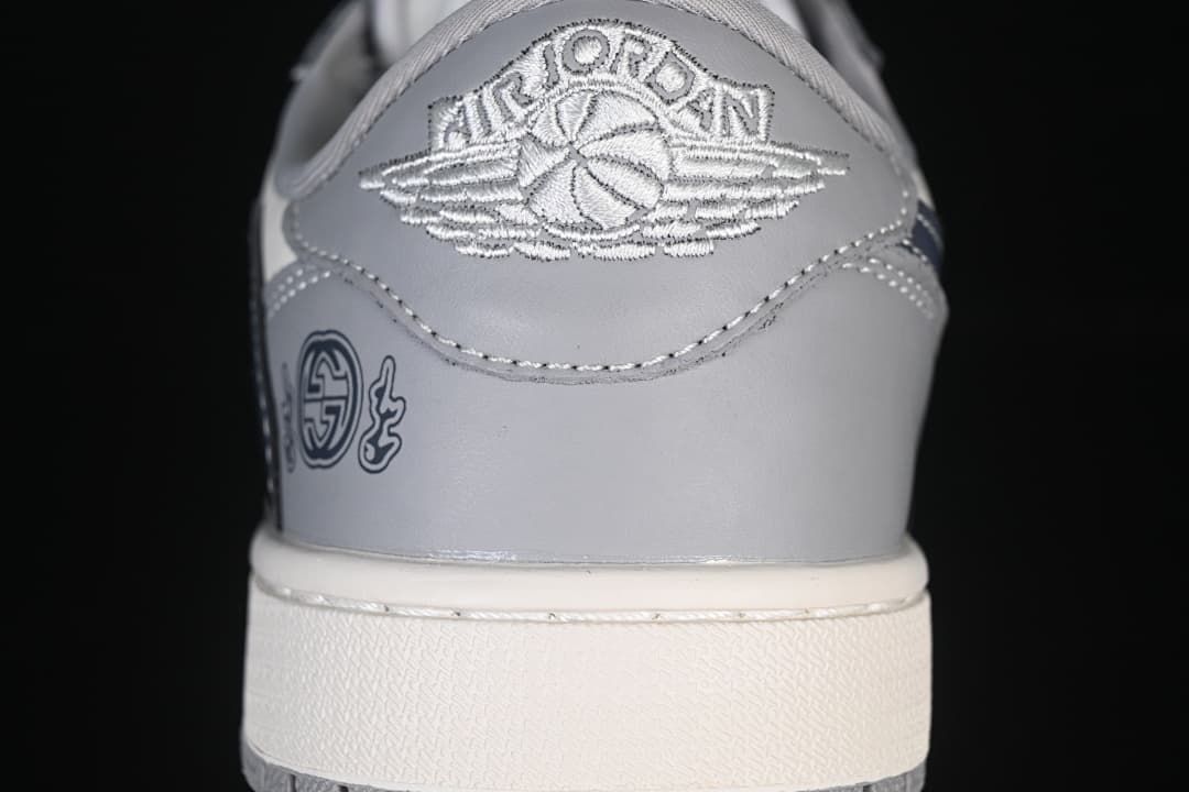 Close-up of the heel with an embroidered Air Jordan emblem and decorative side graphic.