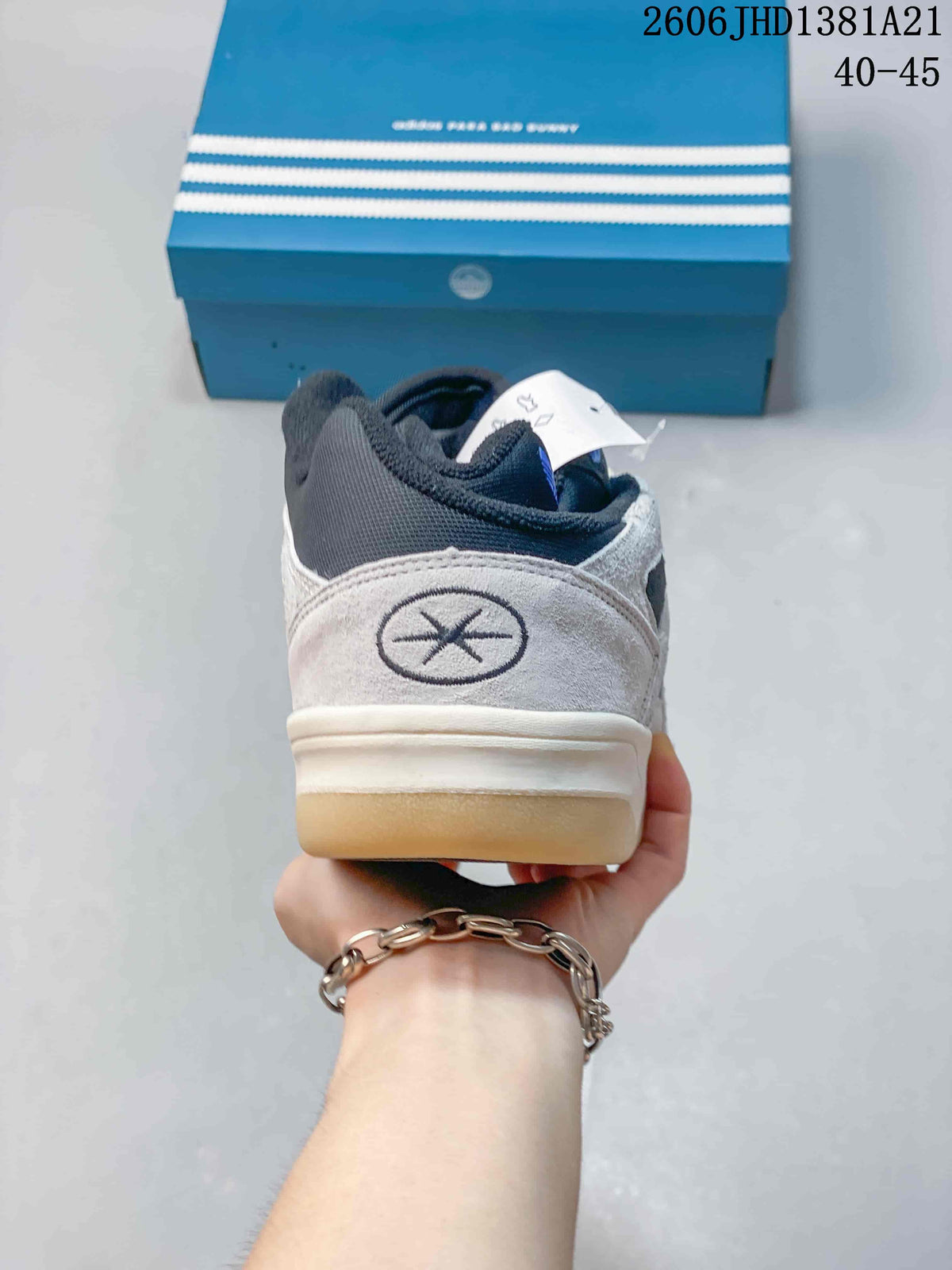 Rear view showing the heel detail of the grey high-top sneaker