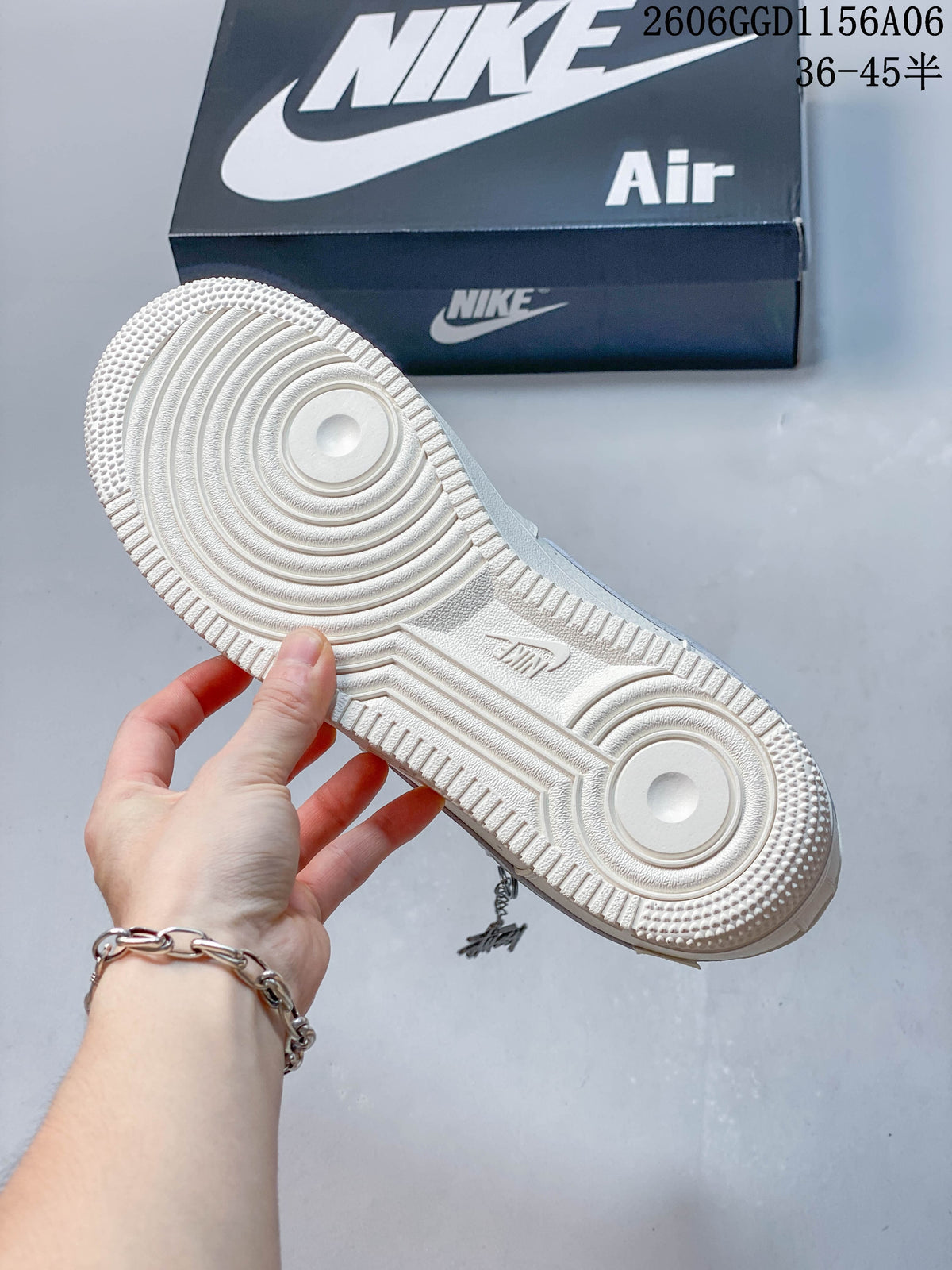Outsole view of an ivory Nike Air Force 1 sneaker